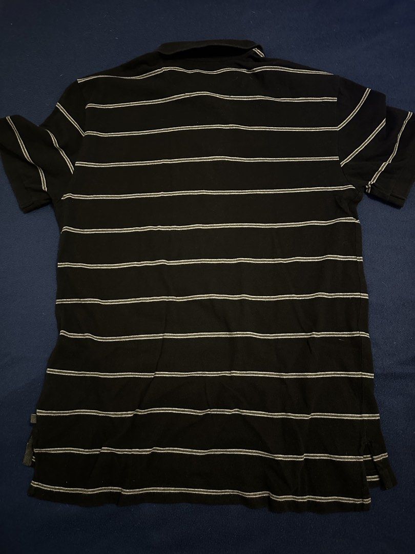 Gap polo shirt (Category: Tshirts & Polo Shirts ) located in Quezon City. Submitted by mancave_stuff (Listing ID 1468186680, Image 2). Description: Gap Black polo shirt Size L: 20” x 28” Black with white stripes Honeycomb fabric Color rate 8/10 No issues.
