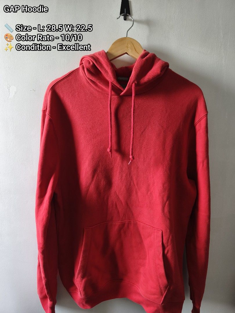GAP Red Hoodie (Category: Hoodies) located in Manila. Submitted by gelog2 (Listing ID 1468146750, Image 1). Description: - Brand: GAP - Color: Vibrant red (zero fading) - Style: Classic pullover with adjustable drawstring hood and front kangaroo pocket - Material: Heavyweight cotton blend for extra warmth - Size/Measurements: Length 28.5 inches, Width 22.5 inches - Condition: Excellent, perfect for everyday wear.