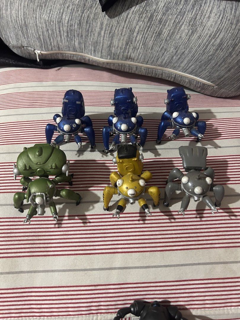Ghost in the Shell Tachikoma figures mini set (Category: Designer & Blind Box Toys) located in Victoria. Submitted by pisangpaulotoys (Listing ID 1468237760, Image 2). Description: - Complete set of 6 Tachikoma spider robot figures from Ghost in the Shell - Includes vibrant colors: blue, green, yellow, and grey, plus an extra black part - Features multi-legged designs, white optic eyes, and intricate mechanical details - Perfect collectible batch