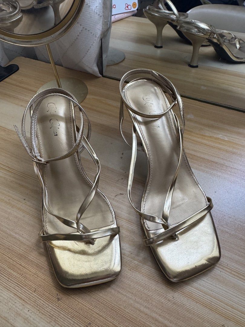 Gold Square Toe Strappy Kitten Heels Size 7 (Category: Heels) located in Manila. Submitted by andreaaarut2 (Listing ID 1468084113, Image 2). Description: only used 2 times :) RFS: not my size Original Price: ₱700 - Color & Style: Gold strappy heels with a chic square toe and kitten heel - Size: US 7 - Closure: Adjustable ankle strap with buckle - Condition: Uppers are in solid shape; minor wear on the soles from previous use - Perfect for: Partie