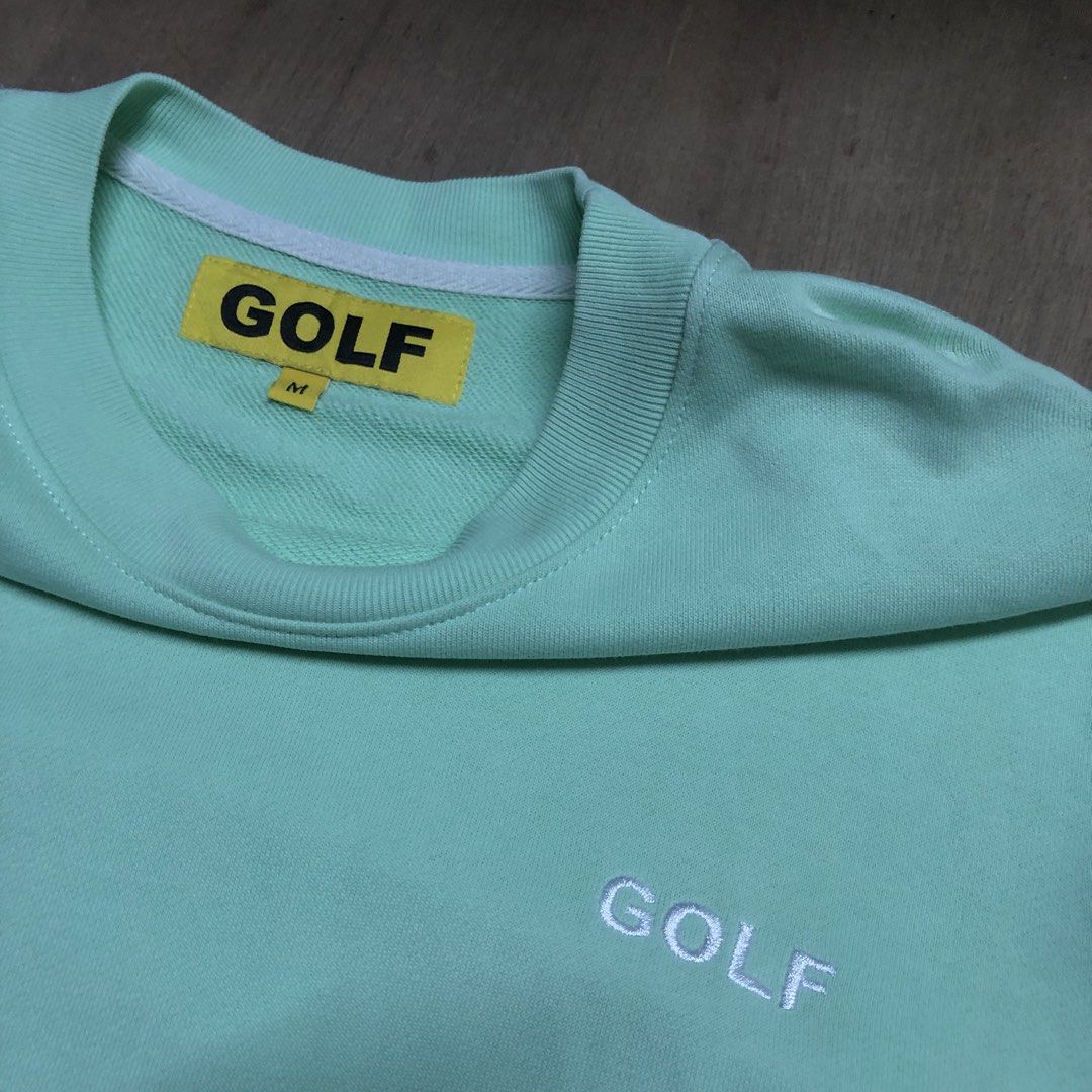 GOLF Wang Mint Green Embroidered Logo Sweatshirt Medium (Category: Coats, Jackets and Outerwear) located in Dasmarinas. Submitted by johnlloydm99208 (Listing ID 1468260285, Image 2). Description: - Brand: GOLF - Color: Mint green - Size: Medium - Material: 100% cotton (Made in Peru) - Design: Small white embroidered chest logo, classic ribbed cuffs, collar, and hem - Details: Features the iconic yellow GOLF inside tag - Condition: Clean, comforta