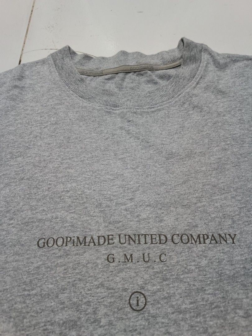GOOPiMADE Grey Graphic Tee (Category: Tshirts & Polo Shirts ) located in Barotac Nuevo. Submitted by gray101 (Listing ID 1468208983, Image 3). Description: - Brand: GOOPiMADE - Color: Grey - Fit: Relaxed fit for daily comfort - Material: Premium soft cotton fabric with a clean neckline - Details: Small GMUC text print on chest - Back Design: Large schematic logo with concept laboratory text - Accent: Signature red branded tag on the lower hem - P