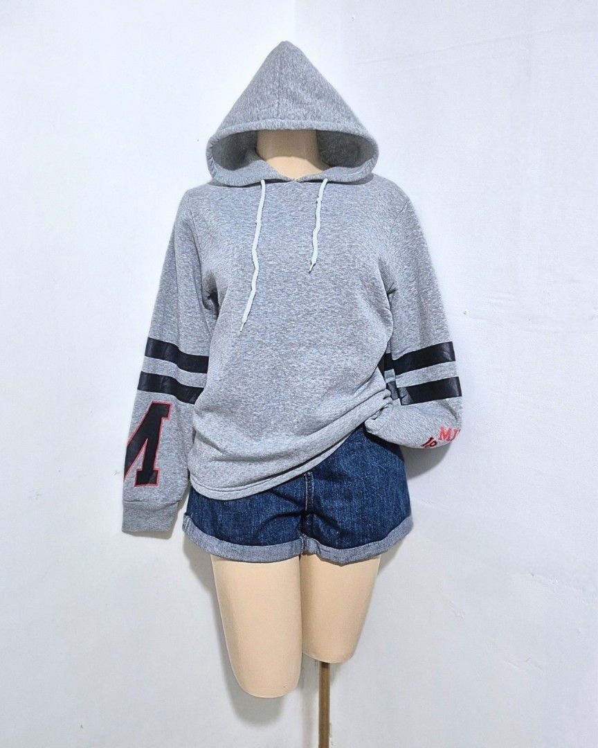 Gray Varsity Letter Hoodie | M-L | Comfy Casual Pullover (Category: Hoodies) located in Cabanatuan. Submitted by _erboutique (Listing ID 1468255586, Image 3). Description: • Heather gray pullover hoodie — varsity style sleeve stripes & letter detail • Soft fleece fabric, adjustable white drawstring hood • Relaxed fit — perfect for everyday wear • Size: M–L | Shoulder: 17" | Bust: 40" | Length: 25" • Code: H1067 • Great preloved condition.