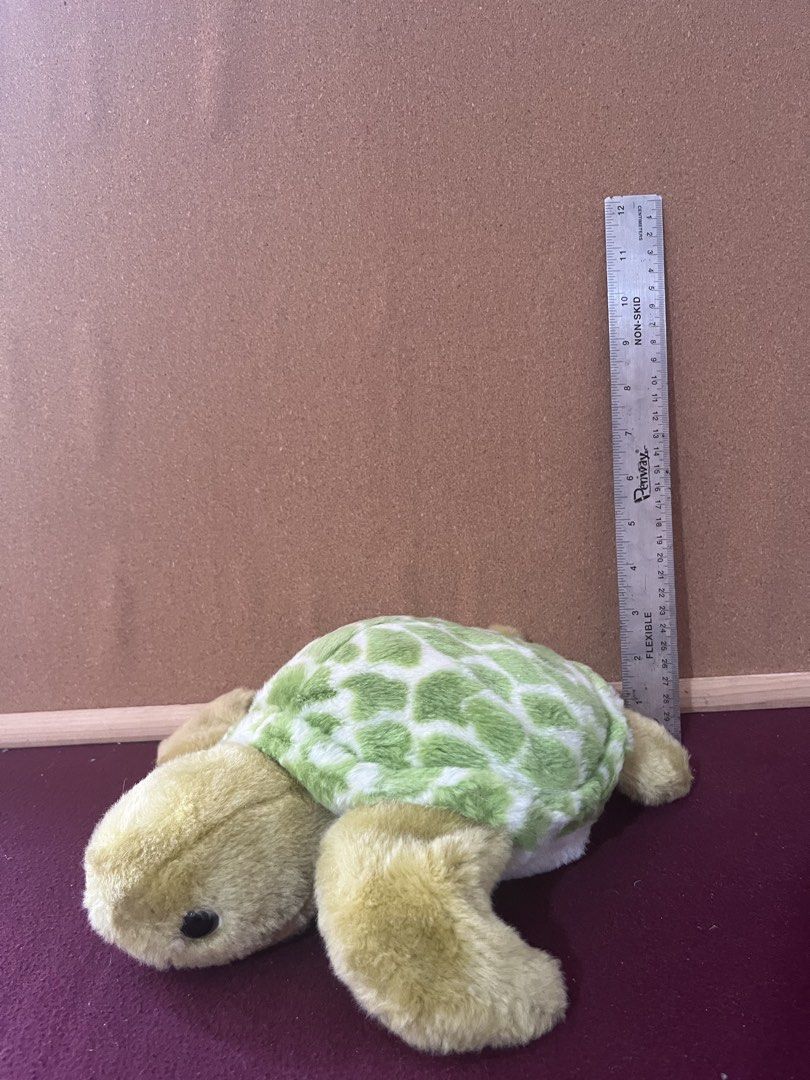 Green and White Sea Turtle Plush Toy (Category: Plushies & Soft Toys) located in Baguio. Submitted by gaara1234 (Listing ID 1468073259, Image 1). Description: - Adorable plush sea turtle toy - Measures approx. 12 cm tall - Soft green and white patterned shell with light green head and flippers - Safe plastic black eyes - Clean fabric with fluffy, huggable stuffing - Stored safely in a smoke-free environment - Great gift for kids or toy collectors