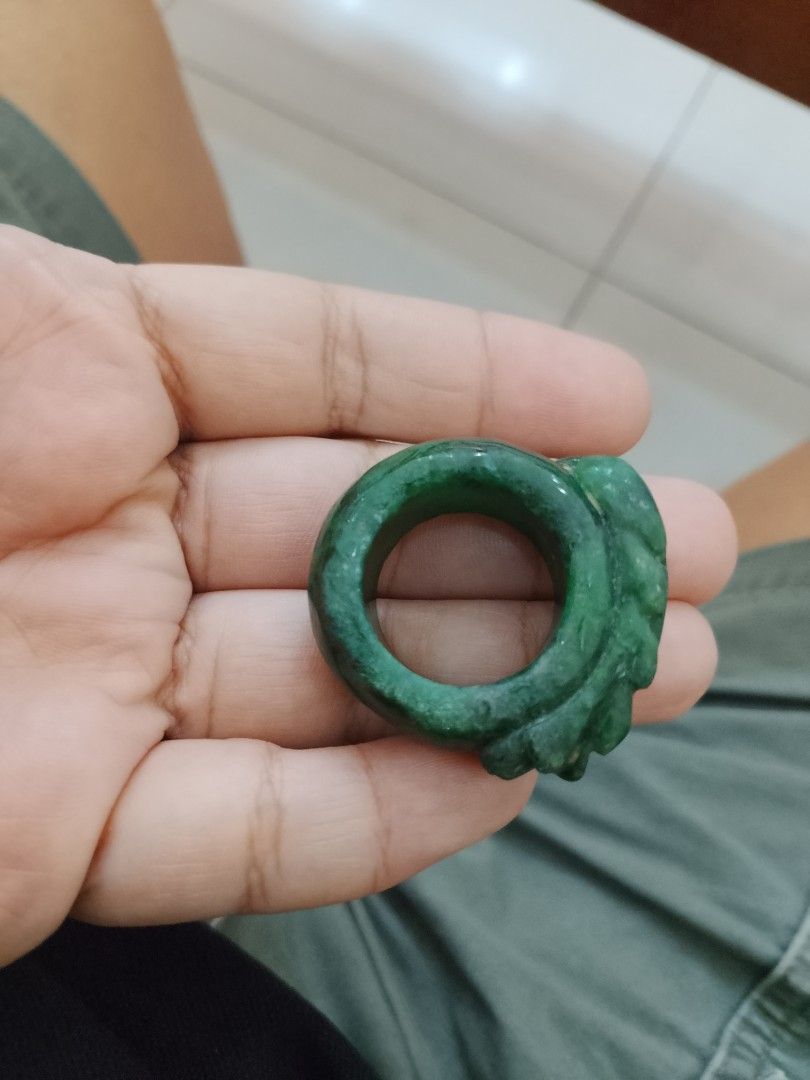 Green Jade Dragon Carved Ring (Category: Jewelry) located in Manila. Submitted by jcagoot67728 (Listing ID 1468095791, Image 3). Description: - Deep green jade ring with rich color and natural mottled patterns - Heavy and chunky band style with a smooth polished finish - Intricate dragon carving wraps around the side - Nice, cool stone weight on the finger - Bold statement piece for daily wear orcollection size 12 the price is negotiable .