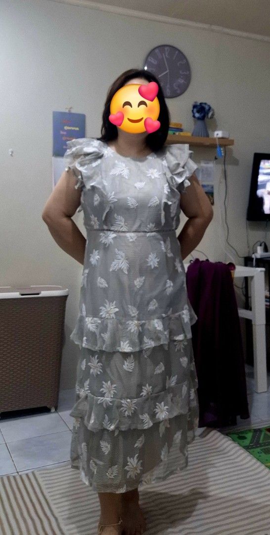 Grey floral patterned tiered ruffled midi dress (Category: Dresses) located in Paranaque City. Submitted by finders_thriftersph (Listing ID 1468190011, Image 1). Description: - Color & Pattern: Grey with white leaf and floral embroidery - Style: Sleeveless with ruffled shoulders and fitted waist - Design: Multi-layered tiered skirt, midi length - Material: Lightweight sheer fabric with solid lining - Condition: Worn once, clean, and ready to wear