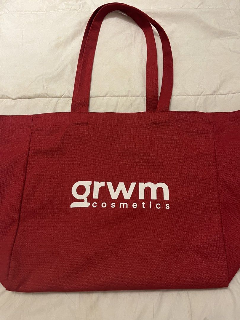 GRWM Cosmetics Red Canvas Tote Bag (Category: Sling Bags) located in Manila. Submitted by beautyarchives (Listing ID 1468199393, Image 1). Description: grwm cosmetics tote bag a little beauty extra for your everyday essentials • sturdy red canvas fabric • iconic grwm cosmetics logo on the front • “beauty is personal” quote on the back • long double handles for easy shoulder carry • perfect for everyday use, school, and casual errands 🎁 FREE gift