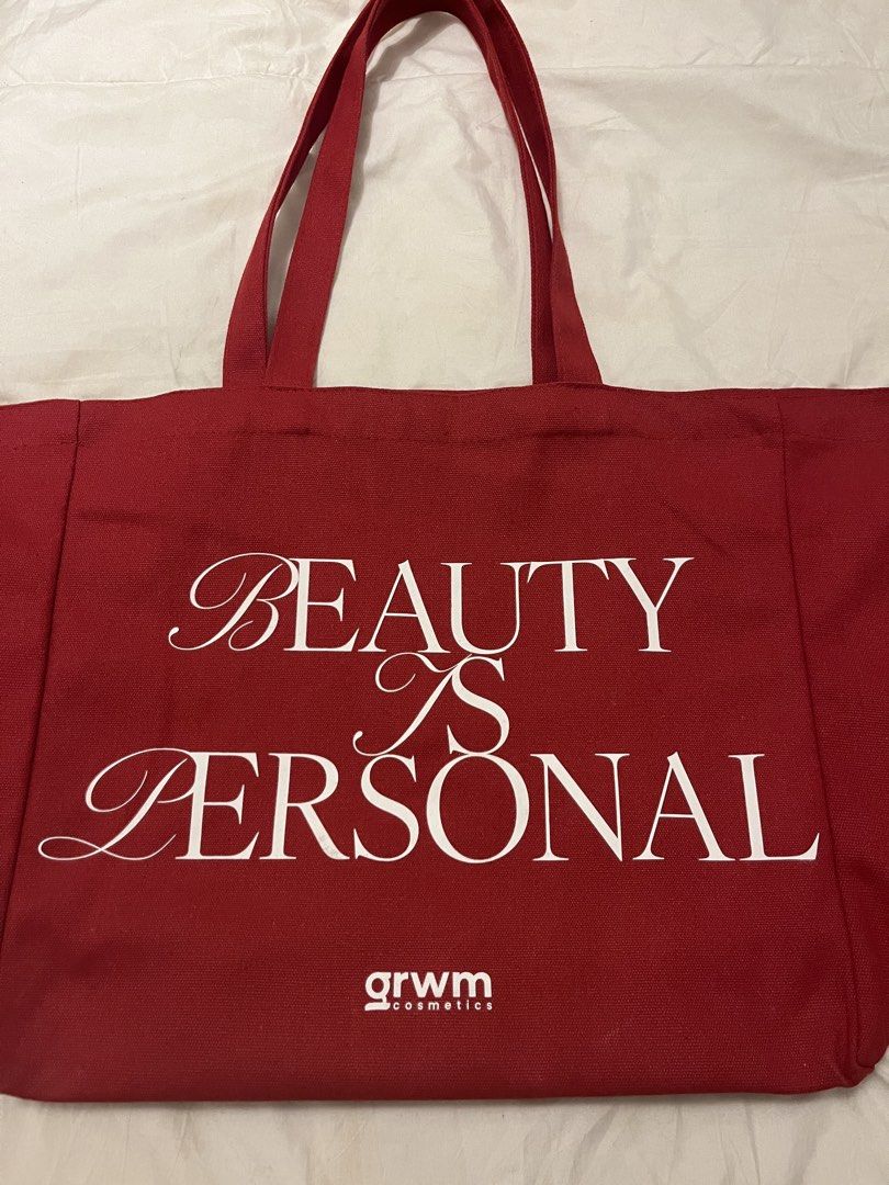 GRWM Cosmetics Red Canvas Tote Bag (Category: Sling Bags) located in Manila. Submitted by beautyarchives (Listing ID 1468199393, Image 2). Description: grwm cosmetics tote bag a little beauty extra for your everyday essentials • sturdy red canvas fabric • iconic grwm cosmetics logo on the front • “beauty is personal” quote on the back • long double handles for easy shoulder carry • perfect for everyday use, school, and casual errands 🎁 FREE gift