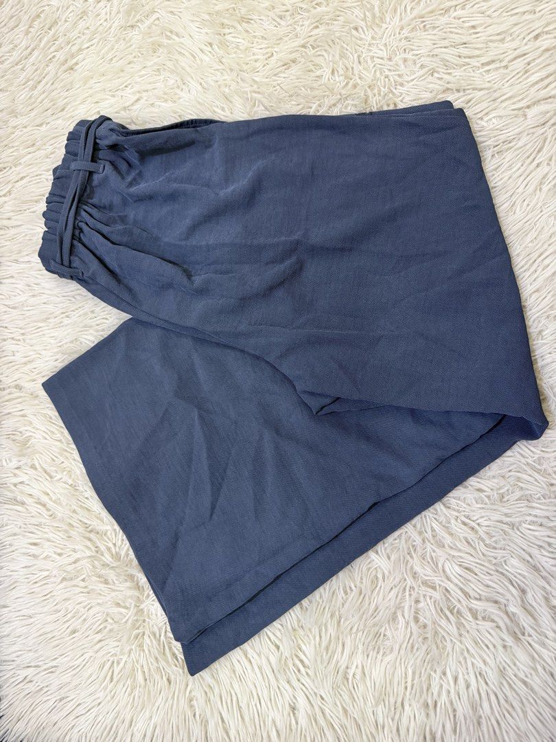 GU Blue Wide Leg Pants Size XL (Category: Jeans) located in Manila. Submitted by kristinata44809 (Listing ID 1468207254, Image 2). Description: - Brand: GU - Style: High-waisted wide leg pants with matching fabric belt - Color: Muted blue - Size: XL (elastic back waistband for extra comfort) - Material: Lightweight textured fabric - Condition: Clean, well-maintained, and ready to wear.