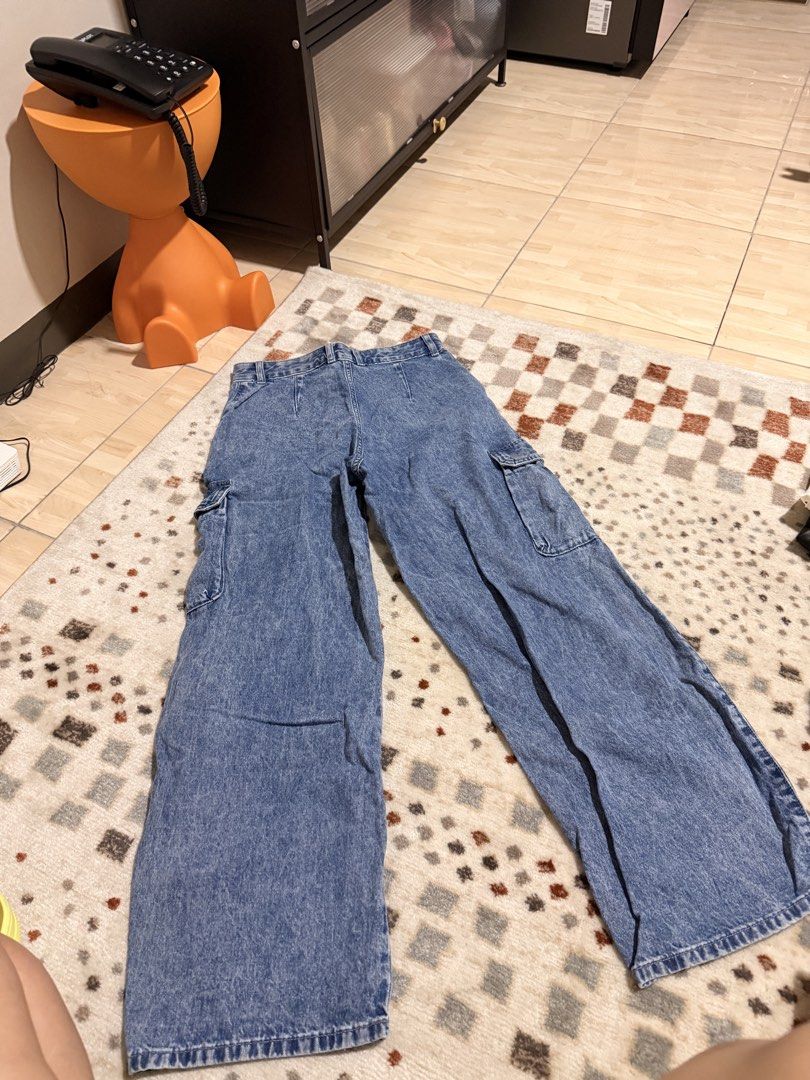 GU Denim Cargo Pants Size M Blue Wide Leg (Category: Jeans) located in Mandaluyong City. Submitted by riz_040521 (Listing ID 1468073709, Image 2). Description: - Brand/Model: GU Denim Cargo Pants - Color/Wash: Blue acid wash - Size: M (Waist: 66cm) - Material: 100% cotton - Fit: Mid-rise, straight wide legs - Features: Cargo pockets on both sides, front zipper and button closure -BOUGHT IN JAPAN 🇯🇵 -worn once.