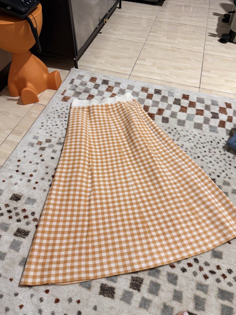 GU Gingham Knit Midi Skirt Yellow Size M (Category: Skirts) located in Mandaluyong City. Submitted by riz_040521 (Listing ID 1468073097, Image 2). Description: - Brand: GU - Style: Knitted midi skirt in a yellow and white gingham pattern - Size: M (tag attached) - Material: Comfortable acrylic knit fabric - Features: Easy pull-on style with an elasticated white waistband -70 cm to 72 cm -BOUGHT IN JAPAN 🇯🇵 .