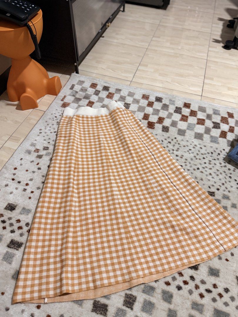 GU Gingham Knit Midi Skirt Yellow Size M (Category: Skirts) located in Mandaluyong City. Submitted by riz_040521 (Listing ID 1468073097, Image 1). Description: - Brand: GU - Style: Knitted midi skirt in a yellow and white gingham pattern - Size: M (tag attached) - Material: Comfortable acrylic knit fabric - Features: Easy pull-on style with an elasticated white waistband -70 cm to 72 cm -BOUGHT IN JAPAN 🇯🇵 .