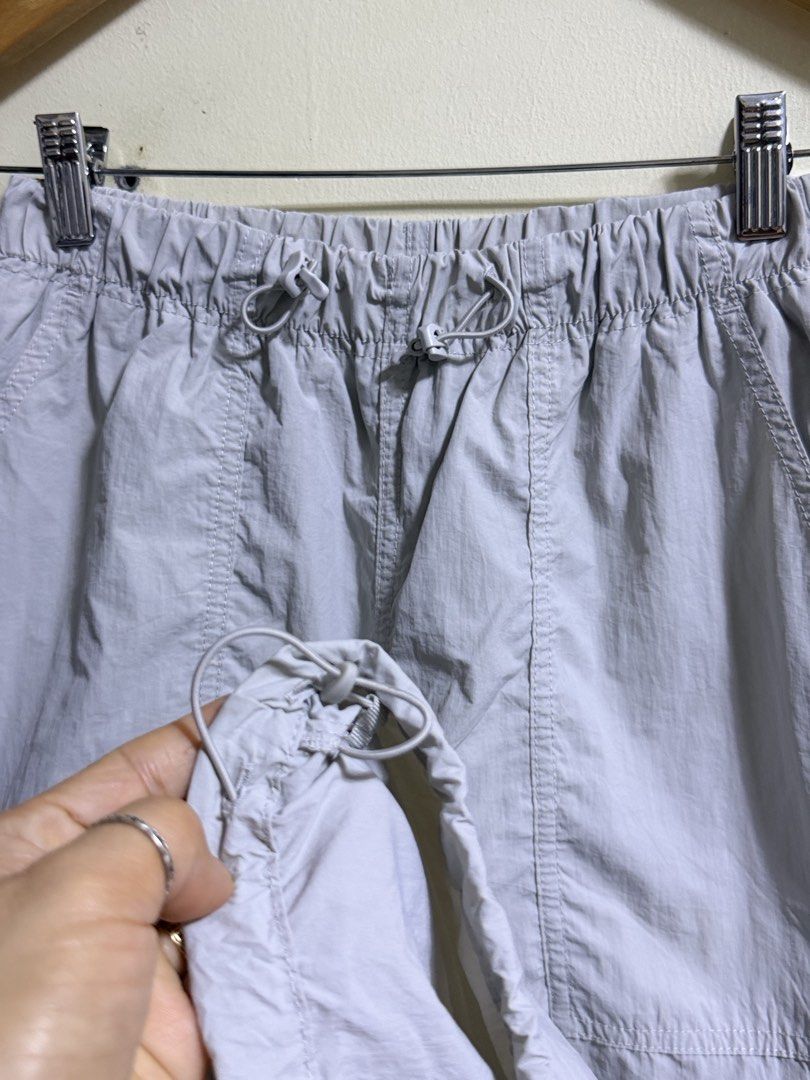 GU Light Grey Nylon Pants Size S (Category: Other Bottoms) located in Paete. Submitted by skydruemadison (Listing ID 1468194035, Image 2). Description: - Brand/Model: GU nylon pants - Color: Light grey - Size: S (fits waist 59-63cm) - Waistband: Elastic with adjustable drawstring - Pockets: Multiple functional pockets on front and back - Cuffs: Adjustable with side drawstrings - Material: Lightweight, ideal for casual streetwear .