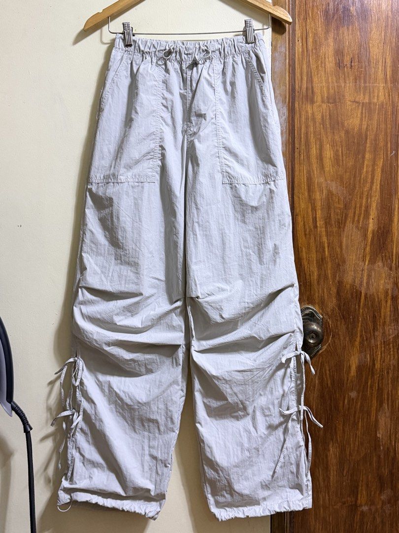 GU Light Grey Nylon Pants Size S (Category: Other Bottoms) located in Paete. Submitted by skydruemadison (Listing ID 1468194035, Image 1). Description: - Brand/Model: GU nylon pants - Color: Light grey - Size: S (fits waist 59-63cm) - Waistband: Elastic with adjustable drawstring - Pockets: Multiple functional pockets on front and back - Cuffs: Adjustable with side drawstrings - Material: Lightweight, ideal for casual streetwear .
