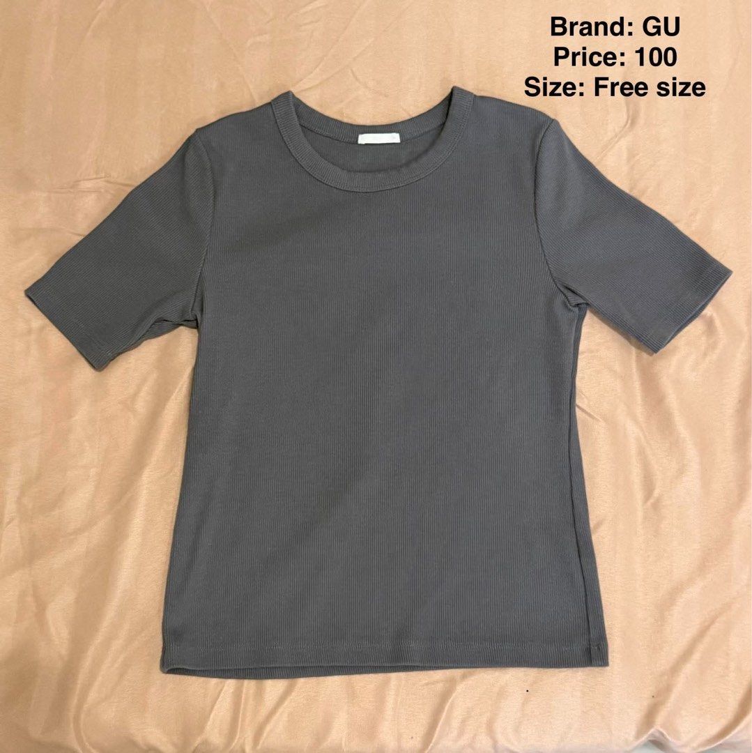 GU Ribbed T-shirt Size M (Category: Shirts) located in Makati City. Submitted by shanineee (Listing ID 1468117838, Image 1). Description: - Brand: GU - Color: Dark grey - Style: Short sleeves, crew neck, ribbed texture - Size: Free size (stretchy fabric) - Condition: Great shape, worn only a few times - Perfect for casual daily wear and easy to match with jeans or skirts.