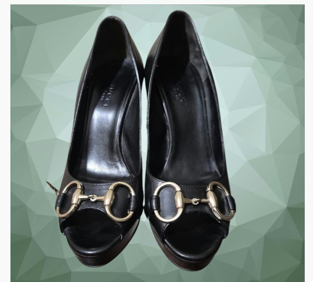 Gucci Black Leather Horsebit Peep Toe Platform Pumps (Category: Heels) located in Paranaque City. Submitted by calm_youngstore7 (Listing ID 1468242873, Image 3). Description: RUSH SALE! - Brand: Gucci - Style: Peep-toe heels / Slip-on - Color: Classic black with gold-tone hardware - Material: Premium leather upper and branded insole, dark wood platform and stiletto heel - Details: Signature horsebit hardware across the toe - Condition: Excellent 