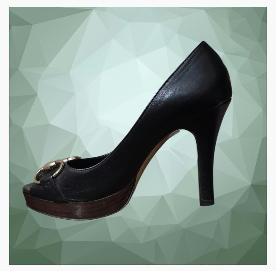 Gucci Black Leather Horsebit Peep Toe Platform Pumps (Category: Heels) located in Paranaque City. Submitted by calm_youngstore7 (Listing ID 1468242873, Image 2). Description: RUSH SALE! - Brand: Gucci - Style: Peep-toe heels / Slip-on - Color: Classic black with gold-tone hardware - Material: Premium leather upper and branded insole, dark wood platform and stiletto heel - Details: Signature horsebit hardware across the toe - Condition: Excellent 