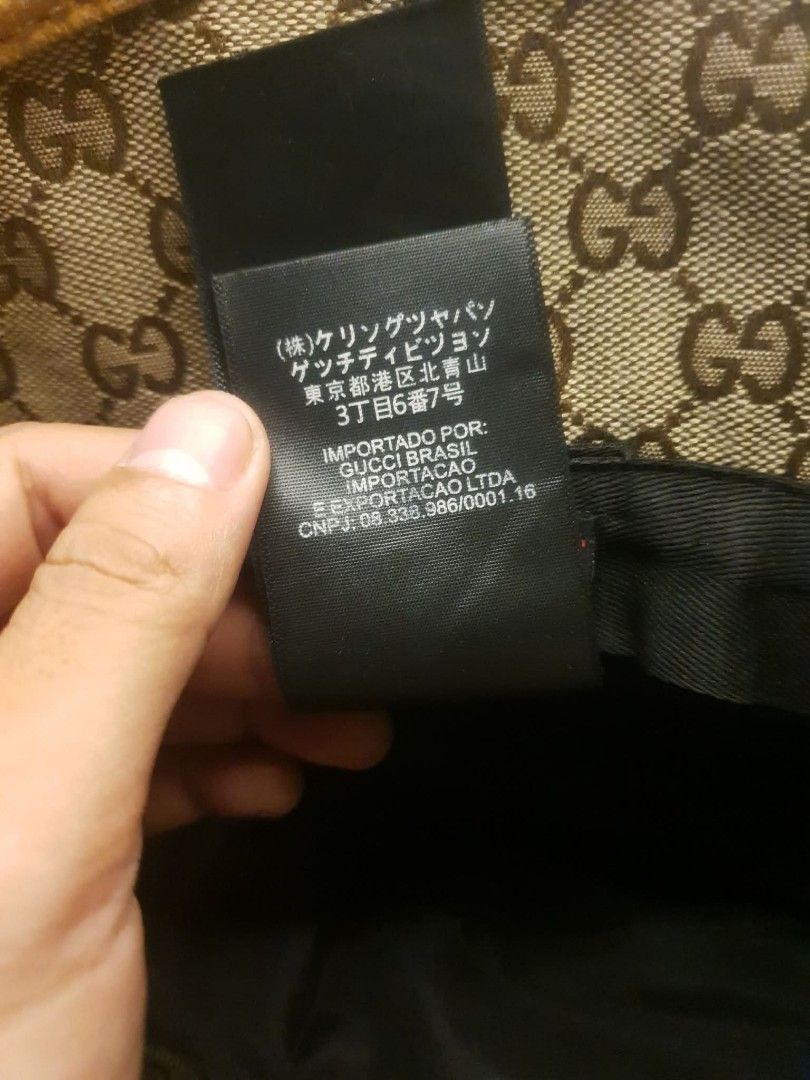 GUCCI GG MONOGRAM BUCKET HAT (Category: Caps & Hats) located in San Fernando. Submitted by _jaximus (Listing ID 1468215906, Image 3). Description: - Authentic Gucci bucket hat in classic GG monogram canvas - Brown leather strap detail with metal interlocking G logo hardware - Vibrant orange suede trim along the brim edge - Crafted in Italy from 100% cotton fabric - Perfect statement accessory for sunny days or streetwear looks - Condition: Great 