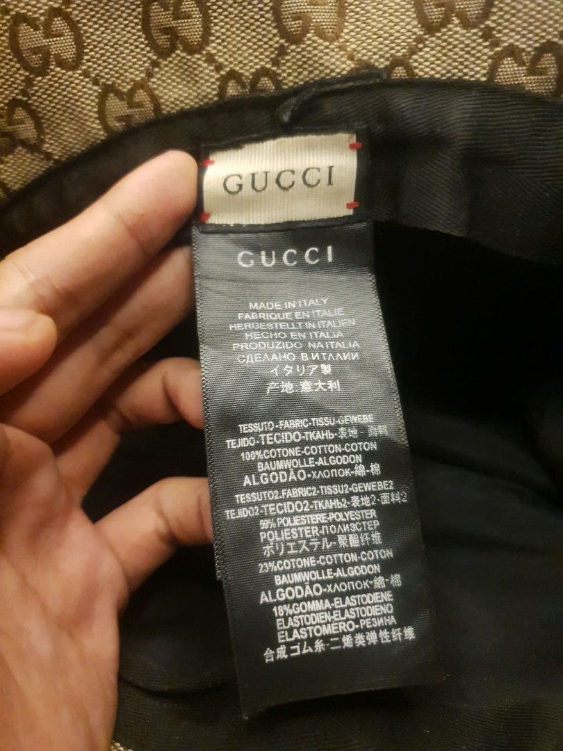 GUCCI GG MONOGRAM BUCKET HAT (Category: Caps & Hats) located in San Fernando. Submitted by _jaximus (Listing ID 1468215906, Image 2). Description: - Authentic Gucci bucket hat in classic GG monogram canvas - Brown leather strap detail with metal interlocking G logo hardware - Vibrant orange suede trim along the brim edge - Crafted in Italy from 100% cotton fabric - Perfect statement accessory for sunny days or streetwear looks - Condition: Great 