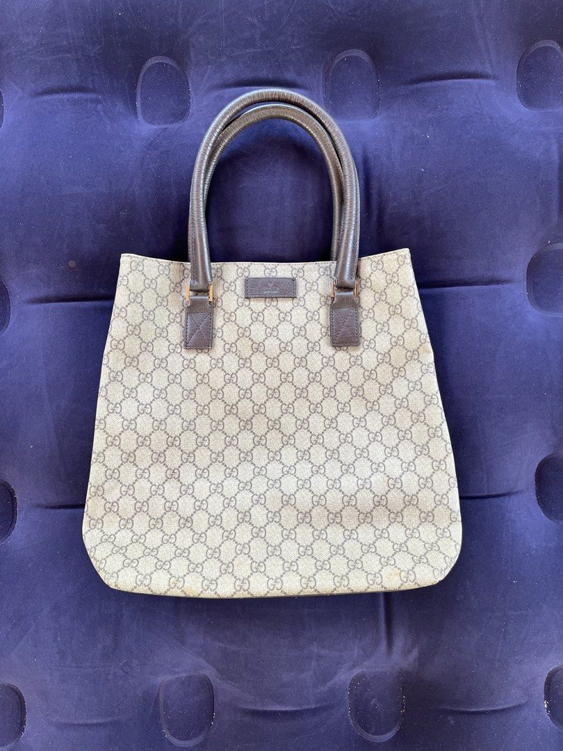 Gucci GG Monogram Canvas Tote Bag (Category: Luxury Bags & Wallets) located in Tacloban City. Submitted by luxbag_phhh (Listing ID 1468083375, Image 1). Description: - Gucci tote bag with iconic GG monogram canvas - Classic brown leather handles and trim - Spacious open-top design, perfect for daily essentials - Structured shape that holds its form well - Condition: Shows minor wear near the bottom corners and edges - Message us if you have any q