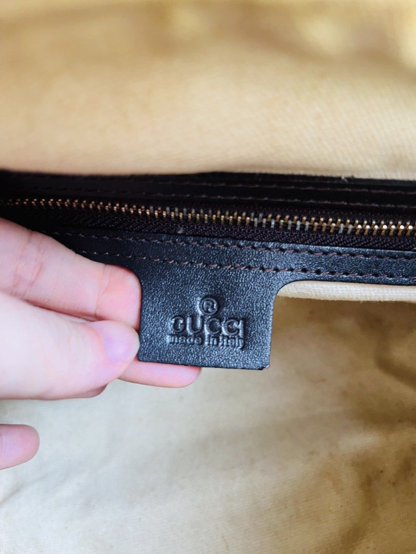 Gucci Monogram Web Boston Bag (Category: Luxury Bags & Wallets) located in Davao. Submitted by goodthingsph_ (Listing ID 1468076855, Image 2). Description: - Classic green and red web stripe with black leather trim - Dual top handles and secure top zip closure - Interior includes a zippered pocket and serial number (269876 4661) - Condition note: Beige interior lining has some staining/wear, and hardware has a worn finish - Perfect everyday luxur