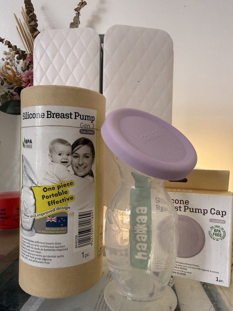 Haakaa Gen. 2 Silicone Breast Pump with Lavender Cap (Category: Breastfeeding & Bottle Feeding) located in Silang. Submitted by graceiixiv (Listing ID 1468069553, Image 1). Description: - Brand: Haakaa Gen. 2 Silicone Breast Pump - Capacity: 5 oz / 150ml - Material: 100% food-grade, BPA-free silicone - Inclusions: Original cylindrical cardboard packaging + separate lavender silicone pump cap in its own box - Condition: Excellent/Clean - Perfect f