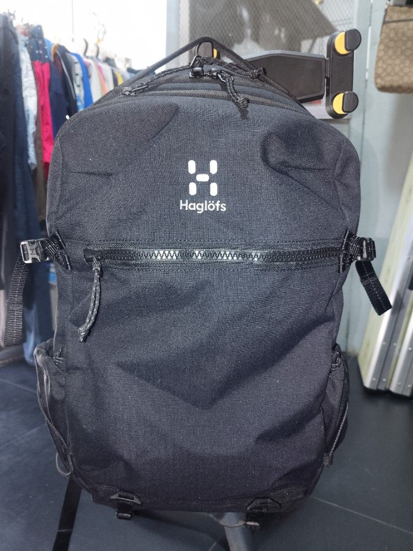 Haglöfs Black Backpack with Orange Interior (Category: Backpacks) located in San Juan City. Submitted by swiftfox.62e2f4 (Listing ID 1468138240, Image 1). Description: - Brand: Haglöfs - Color: Black with bright yellow-orange inner lining - Condition: Clean exterior, sturdy build - Comfort & Support: Mesh back panel, padded shoulder straps, and adjustable sternum strap with buckle - Storage & Pockets: Spacious main compartment, heavy-duty front z