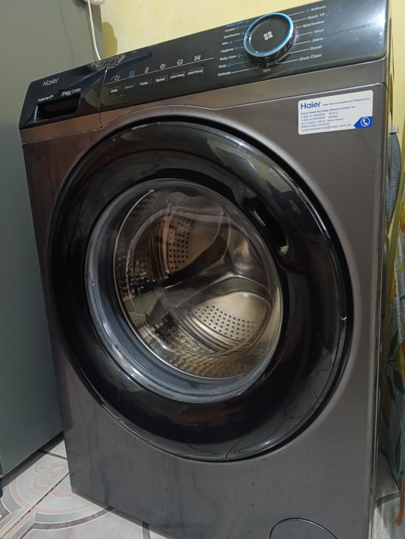 Haier Inverter Front Load Washing Machine (Category: Washing Machines and Dryers) located in Pasig City. Submitted by lucky.avalonchanel (Listing ID 1468133179, Image 1). Description: - Brand/Model: Haier Front Load Inverter Washing Machine (8kg capacity) - Color: Stylish dark grey with a black-rimmed transparent glass door - Control Panel: Modern digital dial with touch controls on the top right - Wash Cycles: Includes Cotton, Quick 15, Wool, Hy