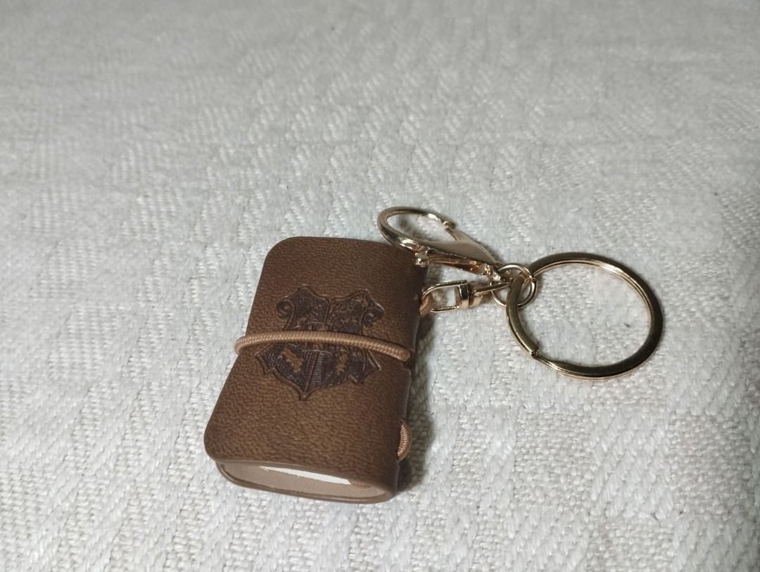 Harry Potter Leather Mini Book Keychain (Category: Western Merchandise) located in Cagayan de Oro. Submitted by pochimart (Listing ID 1468237138, Image 2). Description: A keychain for a potterhead! 🐇 🧡✨ (Check Images Please) ⭐₱80 ✉️Message me if you're interested or have questions, I'm happy to help! 📍Location: CDO / Cagayan De Oro (we can meet up if we're close) 🚚J&T - Message me (buyer covers the shipping fee) 💳GCash.
