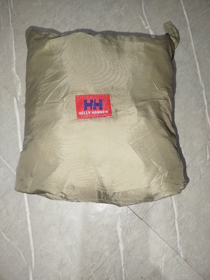 Helly Hansen HH Packable Rain Pants Khaki (Category: Trousers) located in Davao. Submitted by vernoneighty4 (Listing ID 1468156947, Image 1). Description: - Brand: Helly Hansen - Color: Khaki - Material: Lightweight waterproof fabric, ideal for sudden downpours and outdoor hikes - Fit & Features: Comfortable elastic waistband, practical side cargo pocket, and ankle zippers for easy on/off over boots - Portability: Packable design that folds neatl