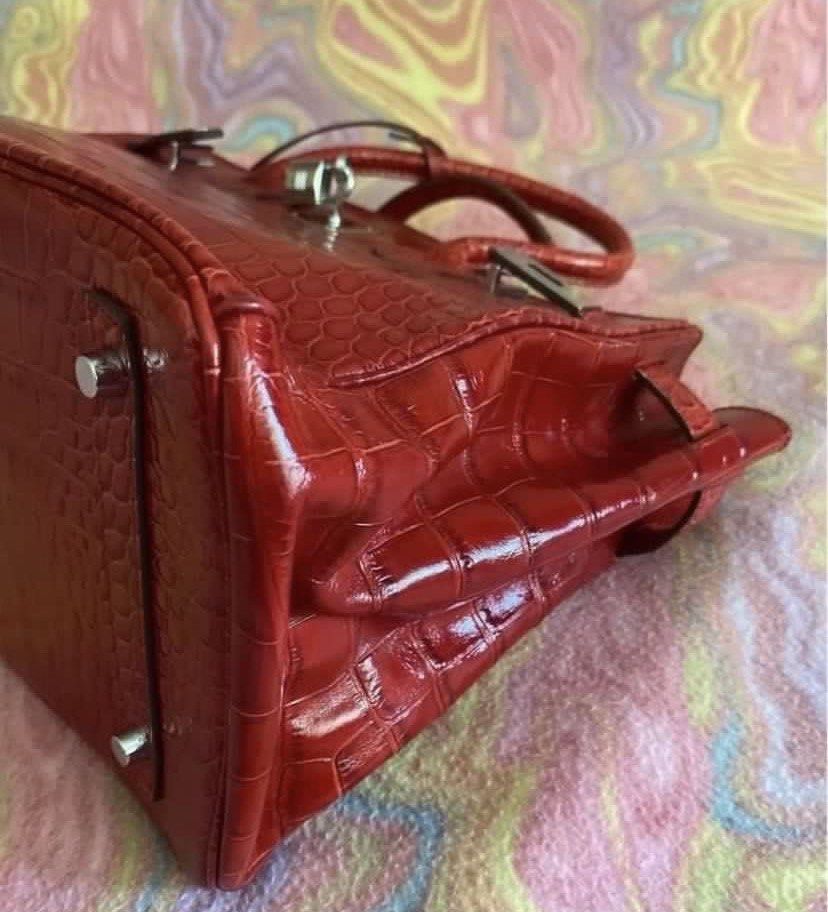 Hermes Birkin Crocodile Leather Handbag (Category: Luxury Bags & Wallets) located in Muntinlupa City. Submitted by hollieberrygirl (Listing ID 1468137189, Image 3). Description: - Brand: Hermes - Material: Genuine wine red crocodile leather with shiny finish - Hardware: Silver-tone with matching padlock and clochette - featuring official branding stamp - Condition: Excellent / Well-maintained - Approx measurements L 13” W 7.5” H 11” - Coded - Wit