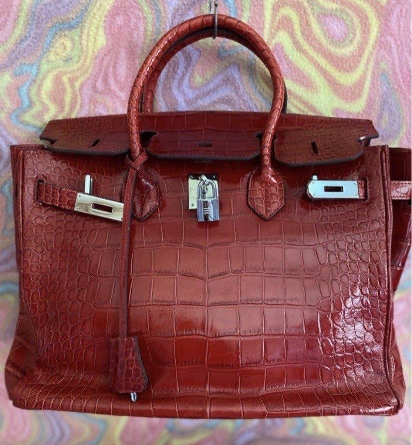 Hermes Birkin Crocodile Leather Handbag (Category: Luxury Bags & Wallets) located in Muntinlupa City. Submitted by hollieberrygirl (Listing ID 1468137189, Image 1). Description: - Brand: Hermes - Material: Genuine wine red crocodile leather with shiny finish - Hardware: Silver-tone with matching padlock and clochette - featuring official branding stamp - Condition: Excellent / Well-maintained - Approx measurements L 13” W 7.5” H 11” - Coded - Wit
