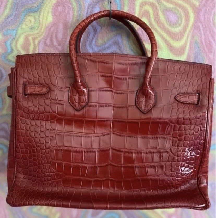 Hermes Birkin Crocodile Leather Handbag (Category: Luxury Bags & Wallets) located in Muntinlupa City. Submitted by hollieberrygirl (Listing ID 1468137189, Image 2). Description: - Brand: Hermes - Material: Genuine wine red crocodile leather with shiny finish - Hardware: Silver-tone with matching padlock and clochette - featuring official branding stamp - Condition: Excellent / Well-maintained - Approx measurements L 13” W 7.5” H 11” - Coded - Wit