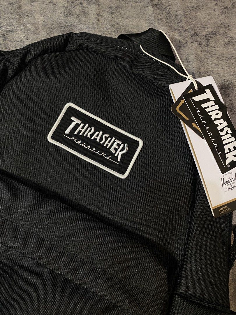 Herschel Supply Co. x Thrasher (Category: Backpacks) located in Manila. Submitted by kiddrevoo (Listing ID 1468159396, Image 2). Description: Herschel Supply Co. x Thrasher Classic XL Backpack in black. This exclusive collab combines Herschel’s classic heritage silhouette with Thrasher Magazine’s iconic skateboarding aesthetic. • Design & Styling: A clean, all-black polyester body accented by a white embroidered Thrasher Magazine logo patch on th