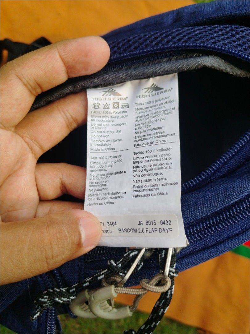 High Sierra Bascom 2.0 Flap Daypack Blue Backpack (Category: Backpacks) located in Legazpi City. Submitted by genobecollectives (Listing ID 1468080096, Image 3). Description: - Brand: High Sierra Bascom 2.0 Flap Daypack - Color: Blue with tan suede bottom panel (has minor dirt marks from previous use) - Material: 100% durable polyester - Closure: Flap top with secure buckle - Pockets: Front zip pockets and interior slip pocket - Comfort: Breathab
