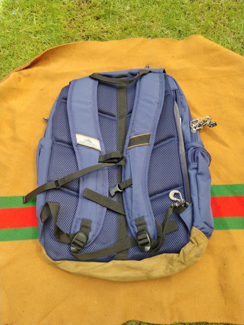 High Sierra Bascom 2.0 Flap Daypack Blue Backpack (Category: Backpacks) located in Legazpi City. Submitted by genobecollectives (Listing ID 1468080096, Image 2). Description: - Brand: High Sierra Bascom 2.0 Flap Daypack - Color: Blue with tan suede bottom panel (has minor dirt marks from previous use) - Material: 100% durable polyester - Closure: Flap top with secure buckle - Pockets: Front zip pockets and interior slip pocket - Comfort: Breathab