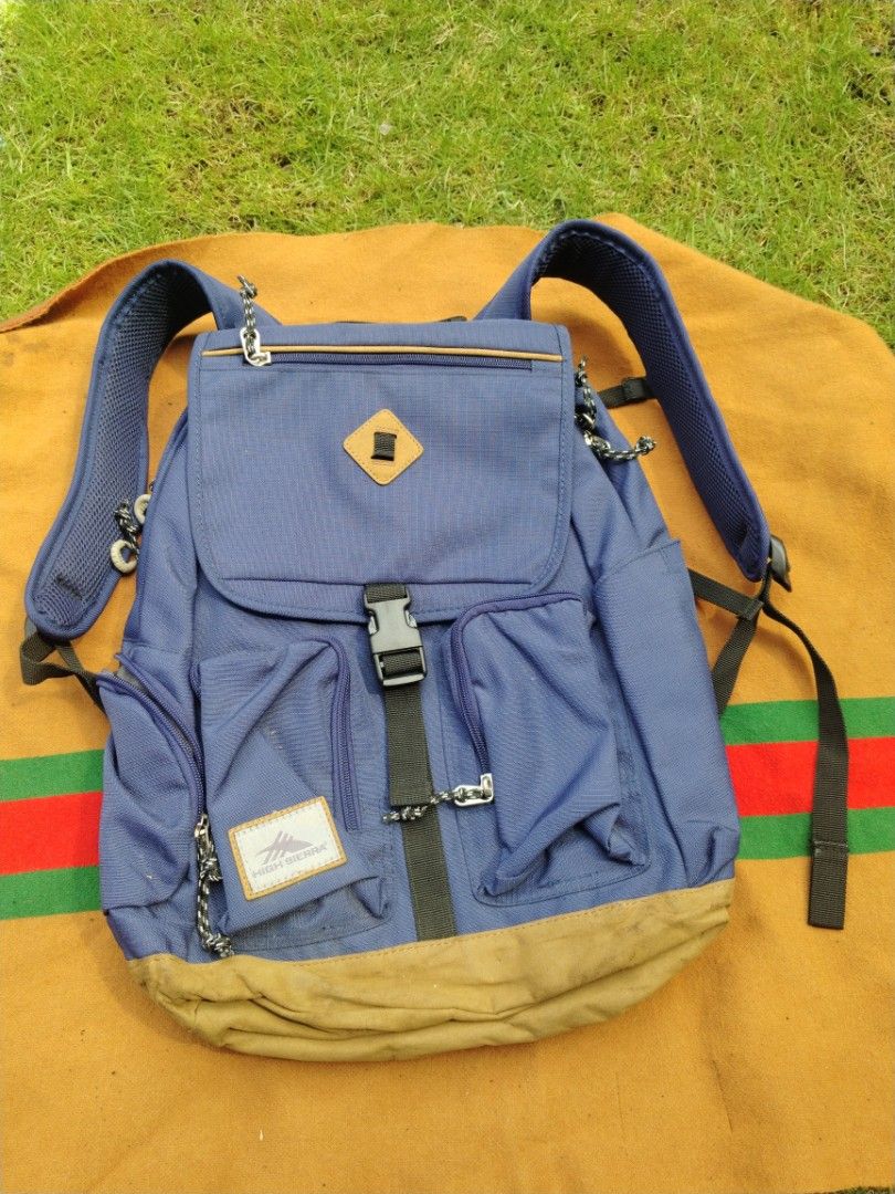 High Sierra Bascom 2.0 Flap Daypack Blue Backpack (Category: Backpacks) located in Legazpi City. Submitted by genobecollectives (Listing ID 1468080096, Image 1). Description: - Brand: High Sierra Bascom 2.0 Flap Daypack - Color: Blue with tan suede bottom panel (has minor dirt marks from previous use) - Material: 100% durable polyester - Closure: Flap top with secure buckle - Pockets: Front zip pockets and interior slip pocket - Comfort: Breathab