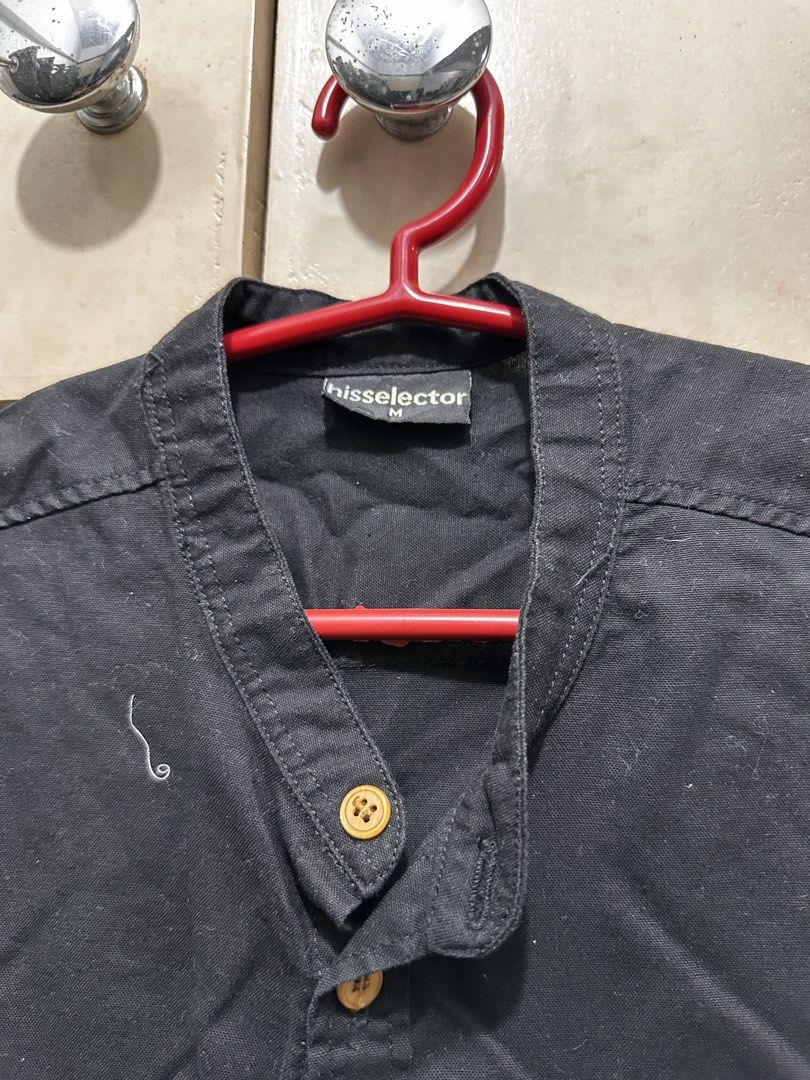 Hisselector Black Mandarin Collar Short Sleeve Shirt Medium (Category: Tshirts & Polo Shirts ) located in Manila. Submitted by vicnoay (Listing ID 1468279060, Image 3). Description: - Brand: Hisselector - Color: Solid black - Size: M. fits up to XS - Collar: Mandarin collar - Closure/Accents: Wooden buttons - Details: Single chest pocket, short sleeves - Condition: Clean, versatile for daily wear.