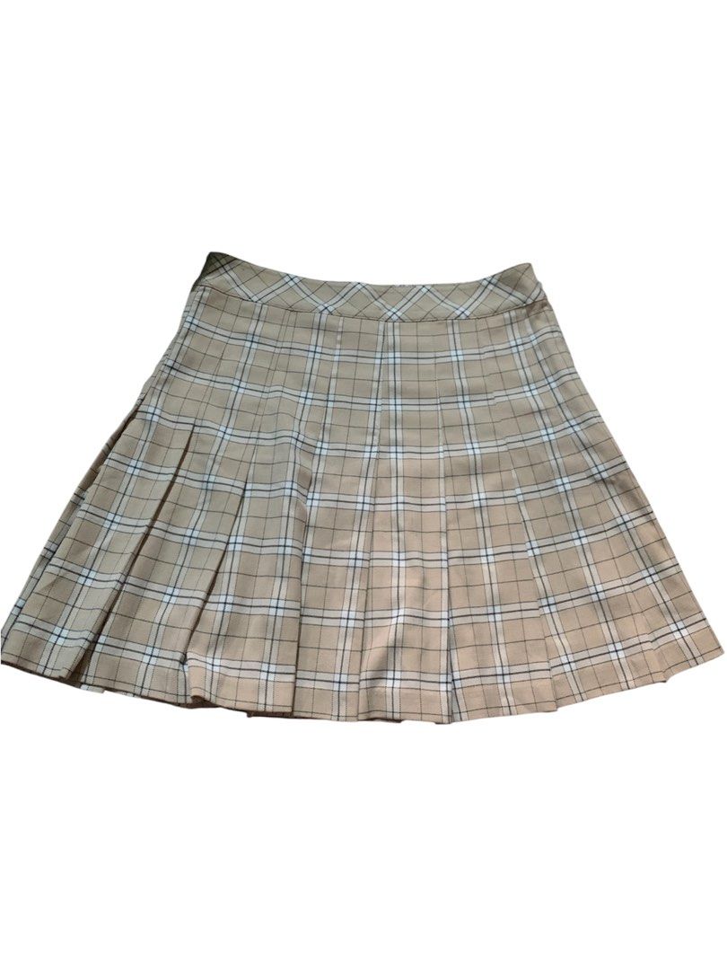 H&M Divided Plaid Pleated Skirt (Category: Skirts) located in Calasiao. Submitted by joyreyes1996 (Listing ID 1468198157, Image 1). Description: - Brand: H&M Divided - Style: High-waisted pleated mini skirt with side zipper closure - Pattern: Classic plaid in beige, white, and black - Size: EUR 36P / US 4P / UK 8P - Condition: Great, perfect for casual wear or schoolgirl-inspired outfits.