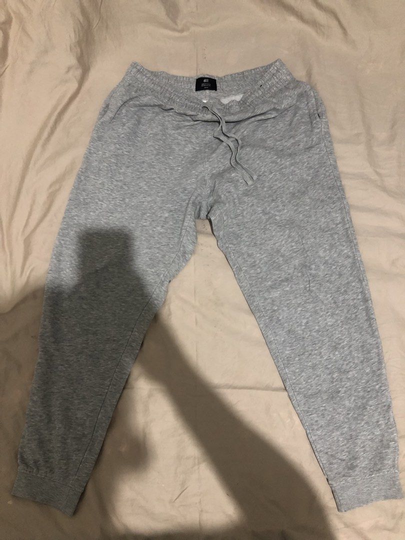 H&M Regular Fit Grey Sweatpants EUR M (Category: Joggers) located in Manila. Submitted by janmichael26601 (Listing ID 1468176671, Image 1). Description: - Brand: H&M - Size: EUR M (Regular Fit) - Color: Grey - Comfort: Soft fleece lining inside - Fit: Elastic waistband with adjustable drawstring and cuffed hems - Best for: Lounging at home or running errands.
