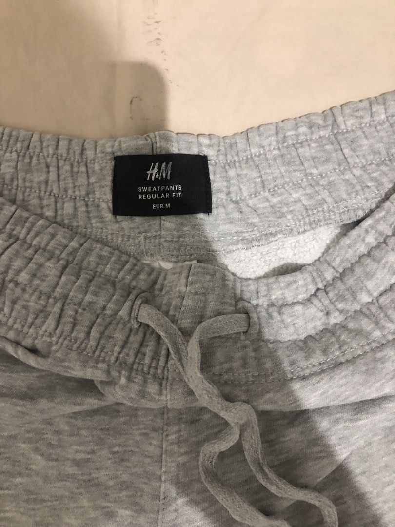 H&M Regular Fit Grey Sweatpants EUR M (Category: Joggers) located in Manila. Submitted by janmichael26601 (Listing ID 1468176671, Image 2). Description: - Brand: H&M - Size: EUR M (Regular Fit) - Color: Grey - Comfort: Soft fleece lining inside - Fit: Elastic waistband with adjustable drawstring and cuffed hems - Best for: Lounging at home or running errands.