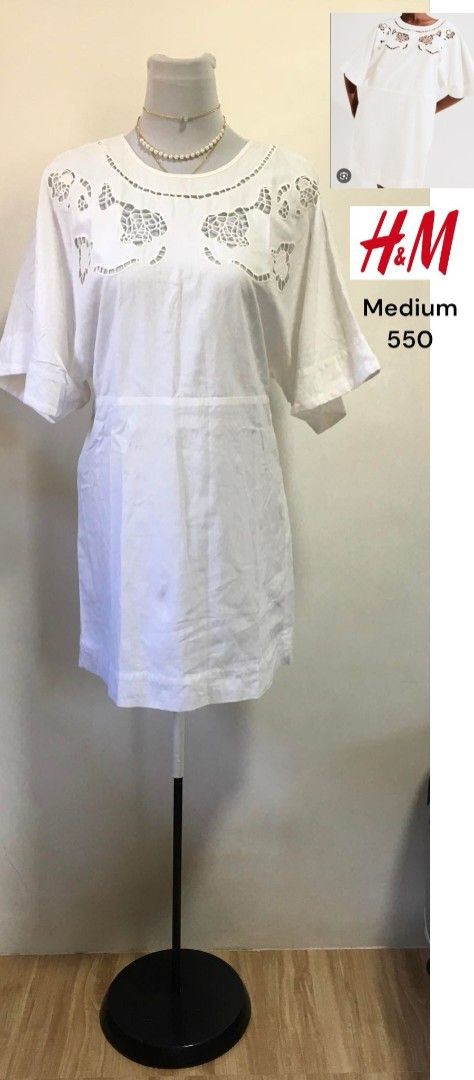 H&M White Dress Medium (Category: Dresses) located in Davao. Submitted by parenasnic86577 (Listing ID 1468071575, Image 1). Description: - Brand: H&M - Size: Medium - Color: White - Design: Laser cut floral pattern on upper chest and shoulders - Fit: Relaxed short sleeves, simple round neckline, mid-thigh length - Material: Lightweight fabric - Condition: Great everyday piece for warm weather.