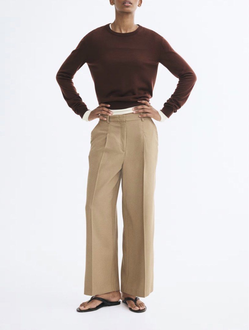 H&M Wool Blend Trousers (Category: Trousers) located in Davao. Submitted by decluttering.dvo (Listing ID 1468089603, Image 1). Description: - Brand/Model: H&M wool blend tailored trousers - Color: Dark Beige - Size: EUR 36, US 4 - Fit & Details: Tailored fit, pleated front, belt loops - Closure & Pockets: Standard zip and button closure, functional side pockets - Condition: Clean material with a well-structured silhouette.