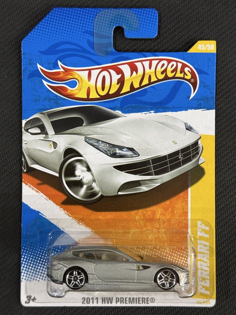 Hot Wheels Ferrari FF (Category: Vehicle & Diecast Models) located in Muntinlupa City. Submitted by eman_garcia_ (Listing ID 1468274315, Image 1). Description: - Brand: Hot Wheels (2011 Premiere Series) - Model: Ferrari FF (Silver) - Scale/Series: #45/244 (Carded 45/50) - Condition: Brand new, unopened original blister pack - Features: Detailed diecast model, realistic wheels, and Scuderia shield logos - Perfect for: Ferrari fans and diecast coll