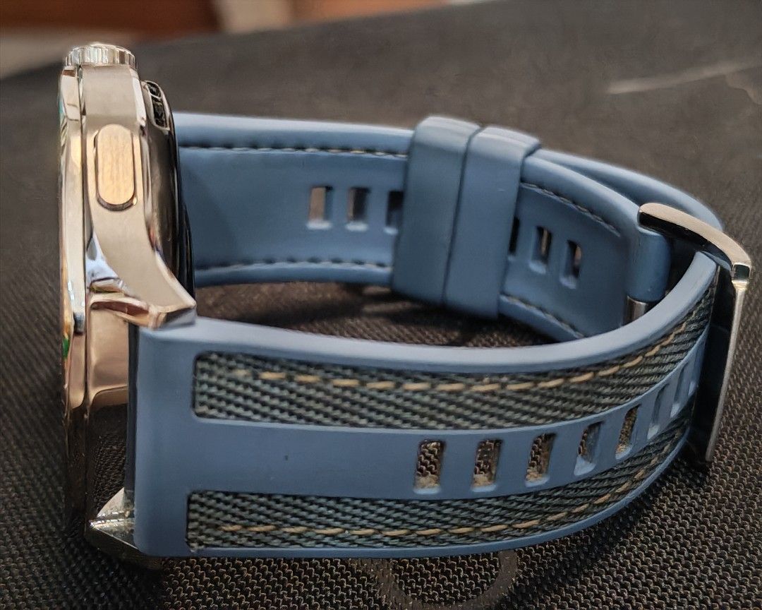 Huawei GT 5 Smartwatch with Blue Strap (Category: Wearables & Smart Watches) located in Quezon City. Submitted by destashingme (Listing ID 1468063003, Image 3). Description: - Model: Huawei Watch GT 5 with silver bezel and textured blue strap - Condition: Fully functional, buttons and rotating crown intact - Battery: Holds charge very well - Inclusions: Original white magnetic charging cable with USB plug - Display: Screen turns on clearly and sh
