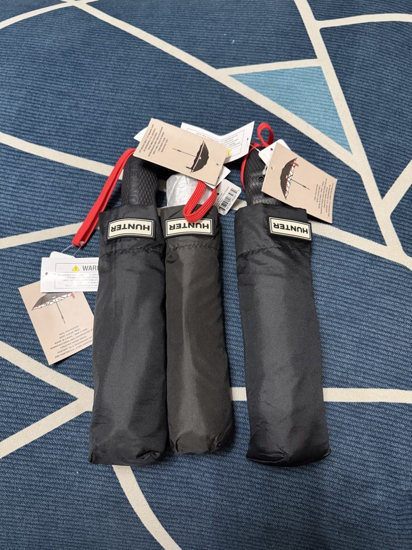 Hunter Compact Automatic Umbrella Black Red Stripes NWT (Category: Umbrellas) located in Quezon City. Submitted by jamboreeee (Listing ID 1468233777, Image 1). Description: - Brand new with original tags attached - Classic black color with stylish red stripes - Includes a matching protective cover - Made of 100% polyester (spot clean only) - Compact and handy size, perfect for everyday bag carry - Keeps you reliably dry during unexpected rain.
