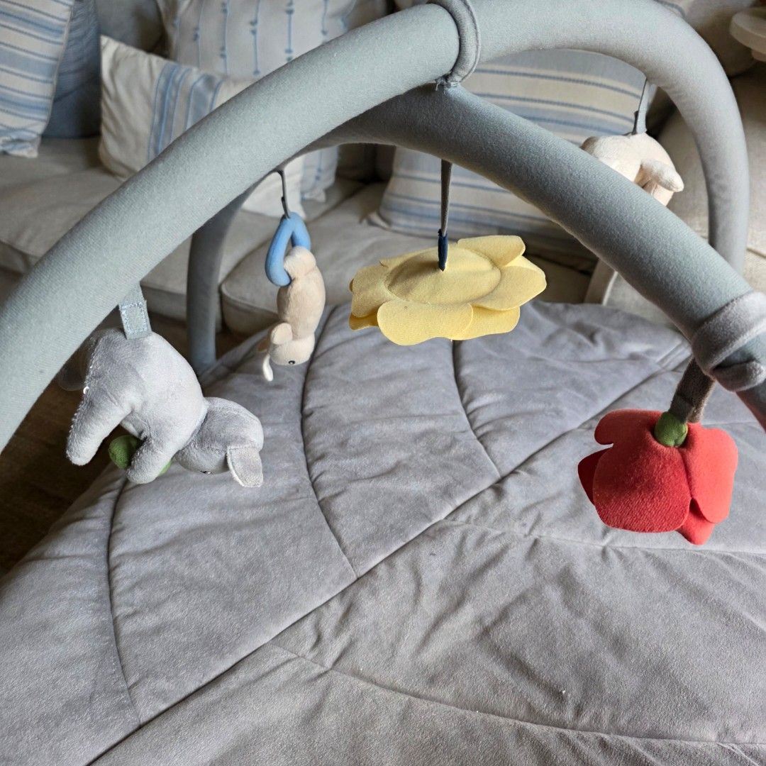 IKEA GULLIGAST Baby gym multicolor (Category: Infant Playtime) located in Manila. Submitted by my23686 (Listing ID 1468110824, Image 3). Description: - Multicolor baby gym featuring a soft, quilted grey mat - Includes sturdy arches with hanging plush toys (bunnies, flower, and rattle rings) - Great for tummy time and sensory development - Easy to assemble and dismantle - Machine washable for hassle-free cleaning.