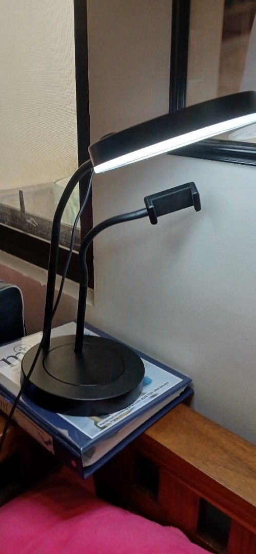 Ikea Ring Lamp with Phone Holder (Category: Lighting) located in Marikina City. Submitted by darthvader888 (Listing ID 1468093020, Image 1). Description: - Brand: IKEA LÅNESPELARE Ring Lamp - Color: Sleek black design - Features: Attached flexible gooseneck phone holder and inline control switch - Lighting: Circular LED ring with bright, adjustable settings - Power: USB-powered cable - Build: Sturdy weighted round base for desk stability - Condit