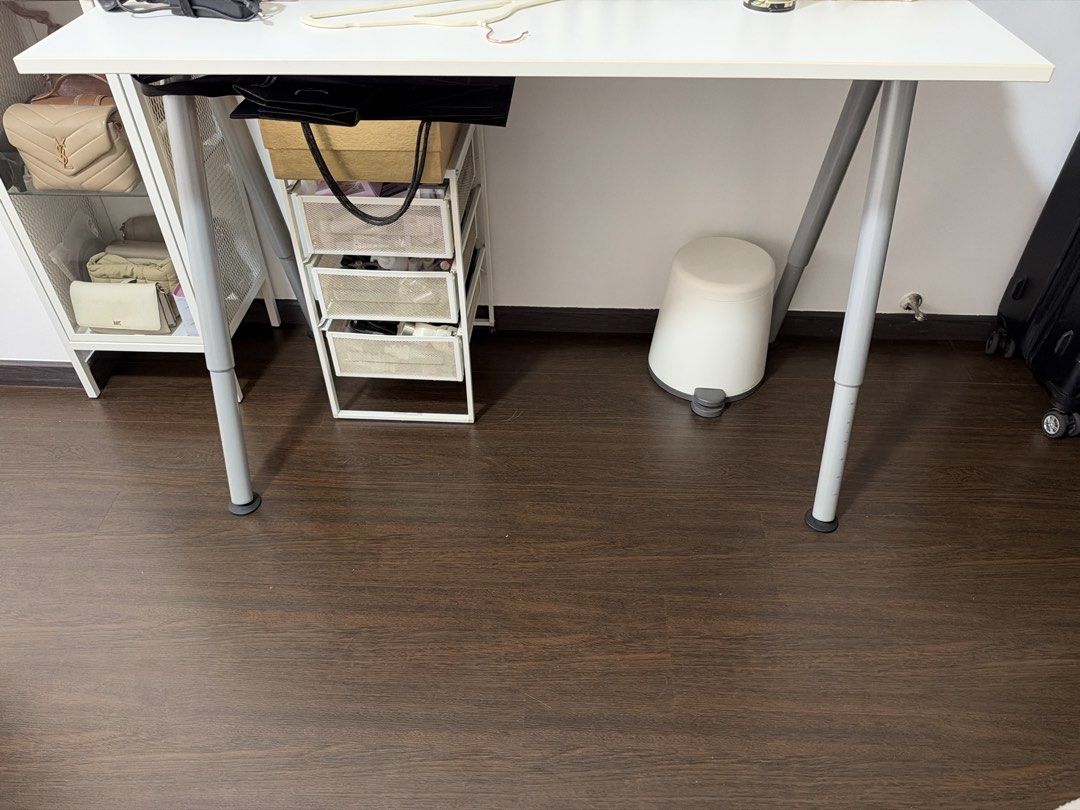 Ikea study table (Category: Tables & Sets) located in Singapore. Submitted by simplydress (Listing ID 1468090734, Image 1). Description: Ikea study table. Very sturdy. Self collect at pasir ris. Adjustable height. Only serious buyer pls..