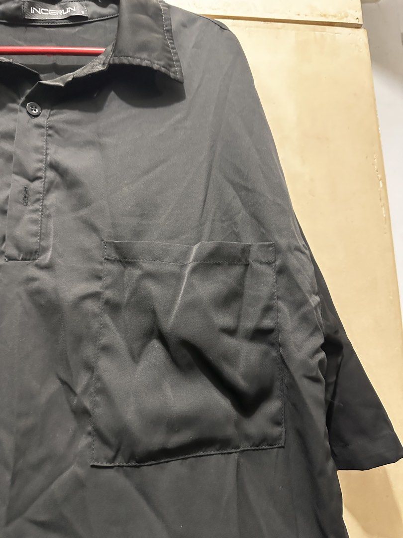 INCERUN Black Oversized Collar Shirt Size S (Category: Tshirts & Polo Shirts ) located in Manila. Submitted by vicnoay (Listing ID 1468279023, Image 3). Description: - Brand: INCERUN - Color: Black - Size: Small (Oversized fit) - Details: Half sleeves, chest pocket, classic collar - Fabric: Smooth and lightweight - Style: Minimalist streetwear - Condition: Good overall condition.